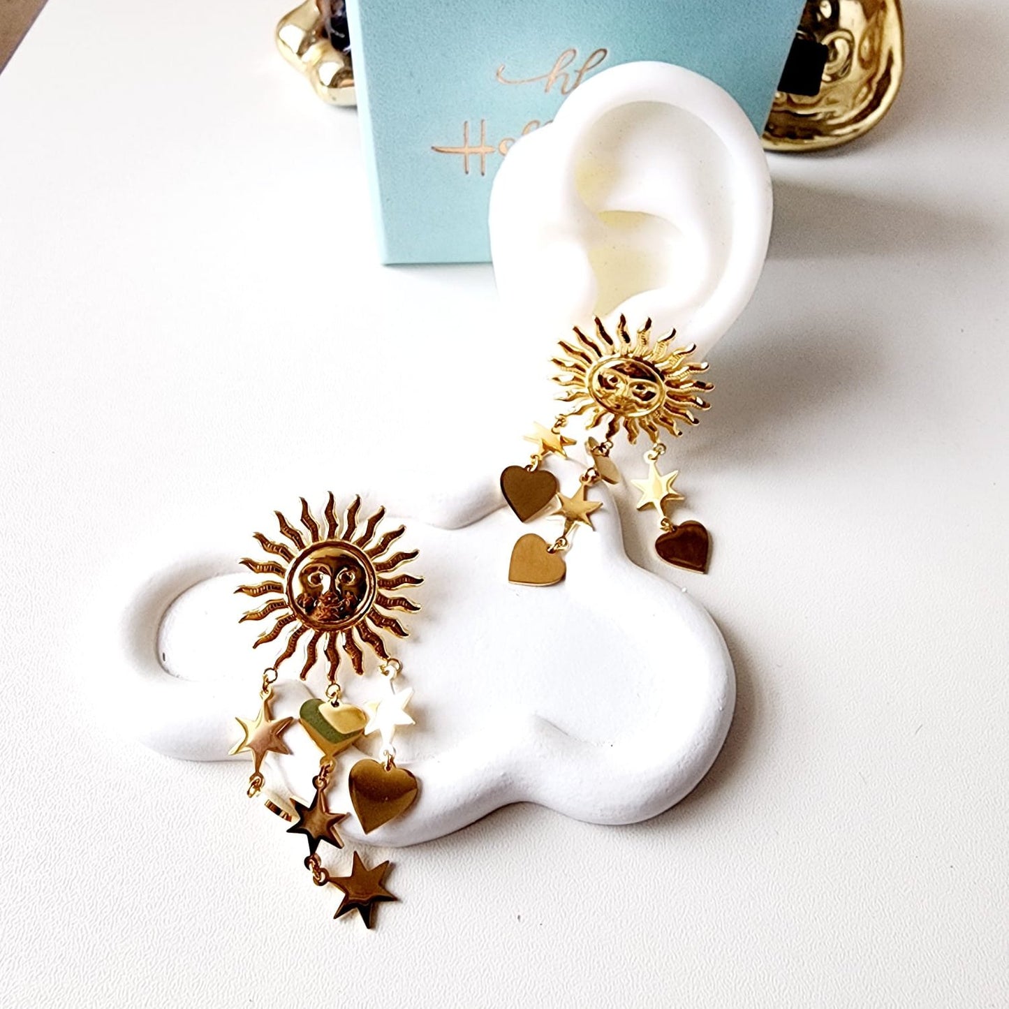 Sun earrings, Gold celestial earrings, Sun and star jewelry, Boho statement earrings,
Unique sun earrings, Sunburst earrings, Celestial jewelry, Star and heart earrings,
Bohemian jewelry style, Gold sun earrings, Dangling celestial earrings, Statement earrings for women, Sun and moon earrings, Vintage-inspired earrings, Spiritual jewelry,
Sun charm earrings, Astrology-inspired jewelry, Durable earrings, Elegant earrings, Timeless design, aesthetic earrings, timeless earrings, Fashion accessories, Stylish je
