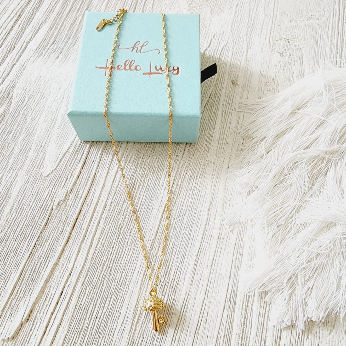 Keywords: Mushroom Gold Necklace, minimalist charm, delicate, simplicity, elegance, understated beauty, dainty pendant, growth, harmony, resilience, water-resistant, high-quality, tarnish-resistant, gold-plated stainless steel, longevity, durability, sleek design, versatile, day to night, casual, formal, must-have accessory, water-resistant, radiant, untarnished, exquisite, thoughtful gift, minimalist beauty.