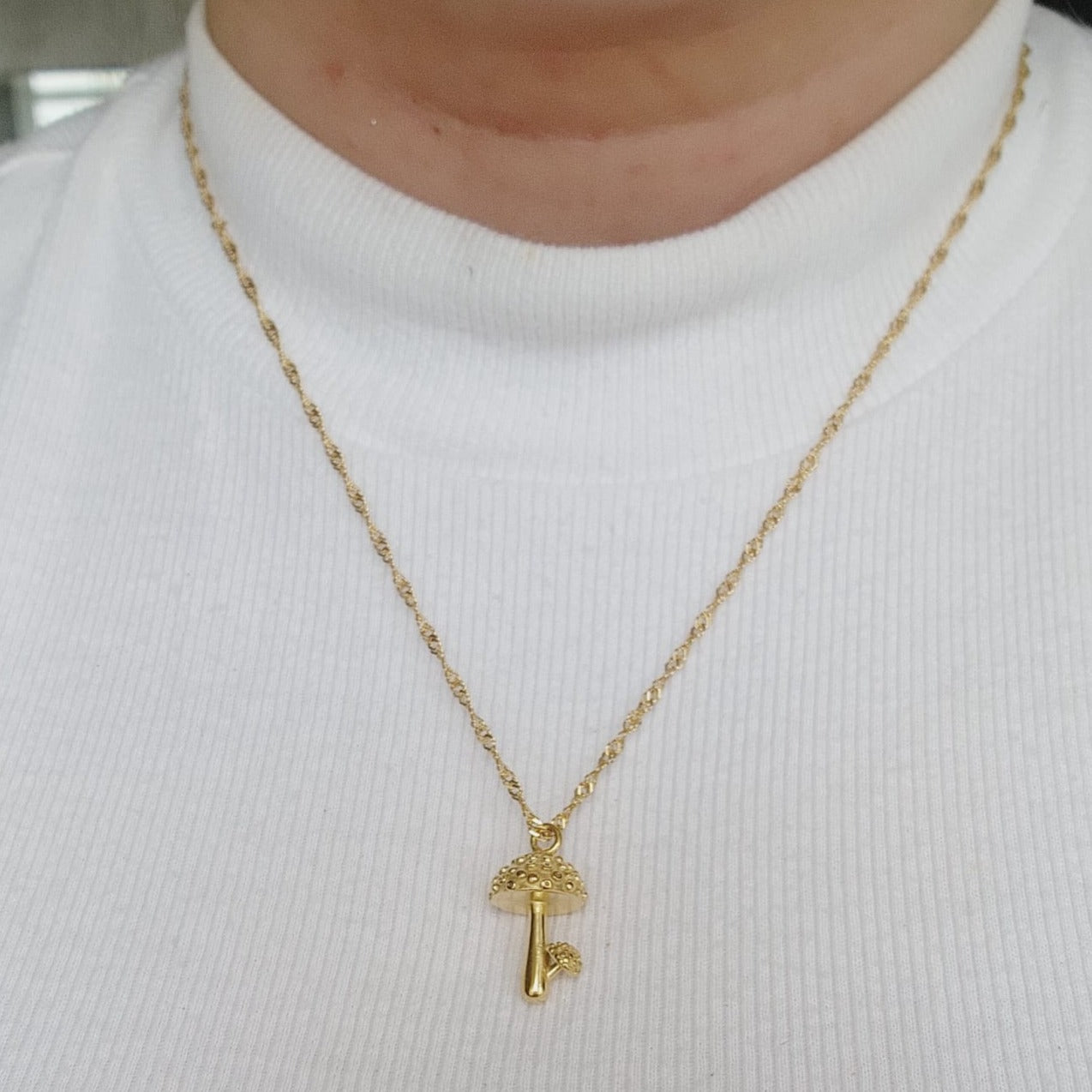 Keywords: Mushroom Gold Necklace, minimalist charm, delicate, simplicity, elegance, understated beauty, dainty pendant, growth, harmony, resilience, water-resistant, high-quality, tarnish-resistant, gold-plated stainless steel, longevity, durability, sleek design, versatile, day to night, casual, formal, must-have accessory, water-resistant, radiant, untarnished, exquisite, thoughtful gift, minimalist beauty.