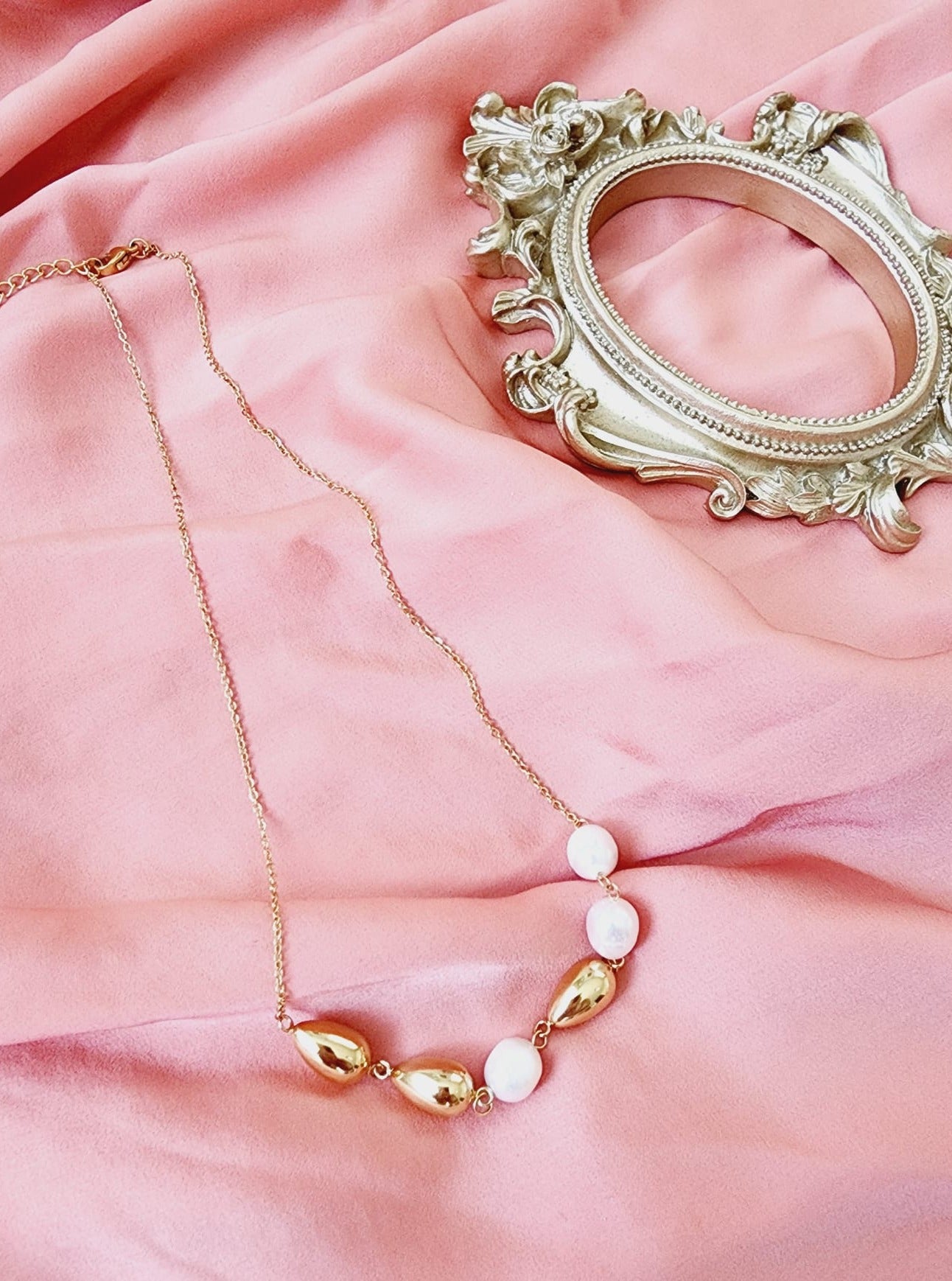 Pearls Gold Necklace, minimalist charm, delicate, simplicity, elegance, understated beauty, dainty pendant, baroque pearls necklace, water-resistant, high-quality, tarnish-resistant, gold-plated stainless steel, longevity, durability, sleek design, versatile, day to night, casual, formal, must-have accessory, water-resistant, radiant, untarnished, exquisite, thoughtful gift, minimalist beauty.