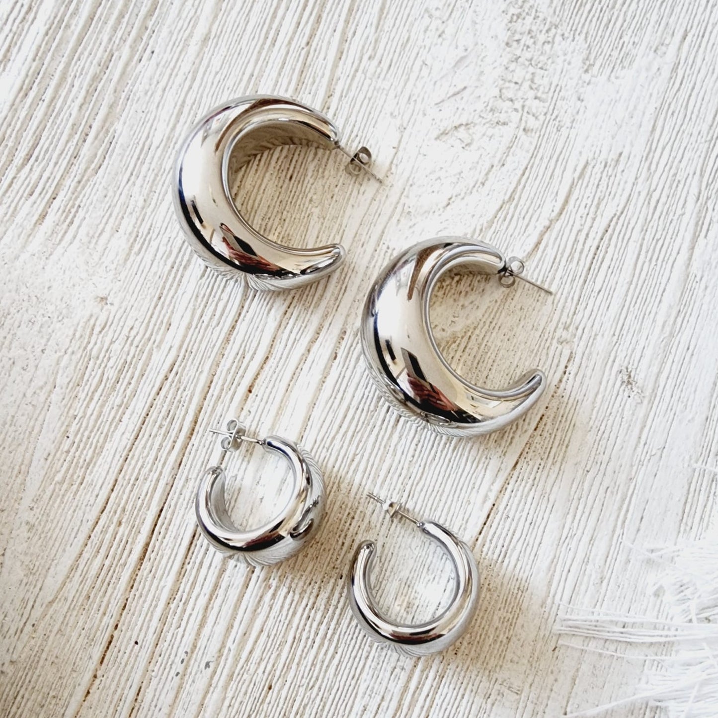 Crescent hoops, moon hoops, silver hoops, hypoallergenic earrings, 18k gold plated earrings, Waterproof earrings, Silver and gold, Durable earrings, Elegant earrings, Timeless design, aesthetic earrings, timeless earrings, Stylish jewelry, stylish earrings, Versatile jewelry, Bold Earrings, Bold hoops, chunky hoops, chunky earrings, Special occasion jewelry, Everyday earrings, Premium quality studs, Affordable luxury Hypoallergenic earrings waterproof earrings, water resistant earrings, silver studs