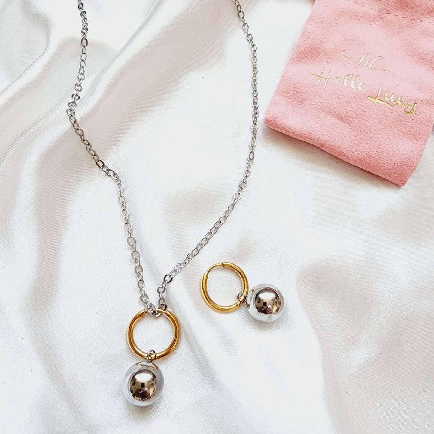 two tone hoops, two tone small earrings, two tone classy earrings, hypoallergenic earrings, two tone everyday hoops, 18k gold plated earrings, Waterproof earrings, Silver and gold earrings, Durable earrings, Elegant earrings, Timeless design, aesthetic earrings, timeless earrings, Stylish jewelry, stylish earrings, Versatile jewelry, Bold Earrings, chunky earrings, Bottega Tear drop earrings, Bottega Veneta Earrings