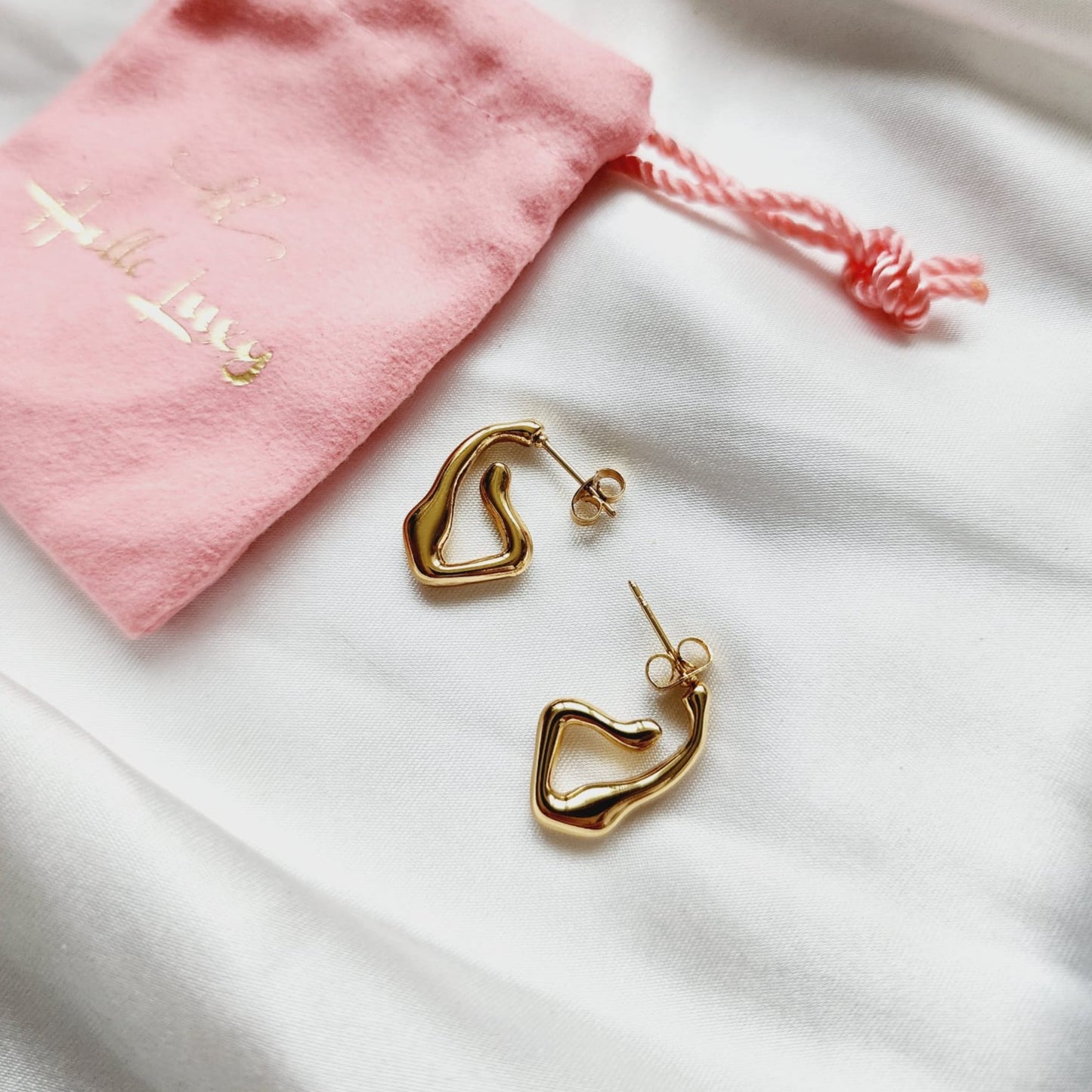 Lightweight hoops, Small Abstract hoops, abstract hoop earrings, hearts silver earrings, hearts silver medium earrings, Silver classy earrings, hearts earrings, self love earrings, silver chunky hearts earrings, two tones chunky earrings, hypoallergenic earrings, two tone everyday hoops, 18k gold plated earrings, Waterproof earrings, Silver and gold earrings, Durable earrings, Elegant earrings, Timeless design, aesthetic earrings, timeless earrings, Stylish jewelry, stylish earrings