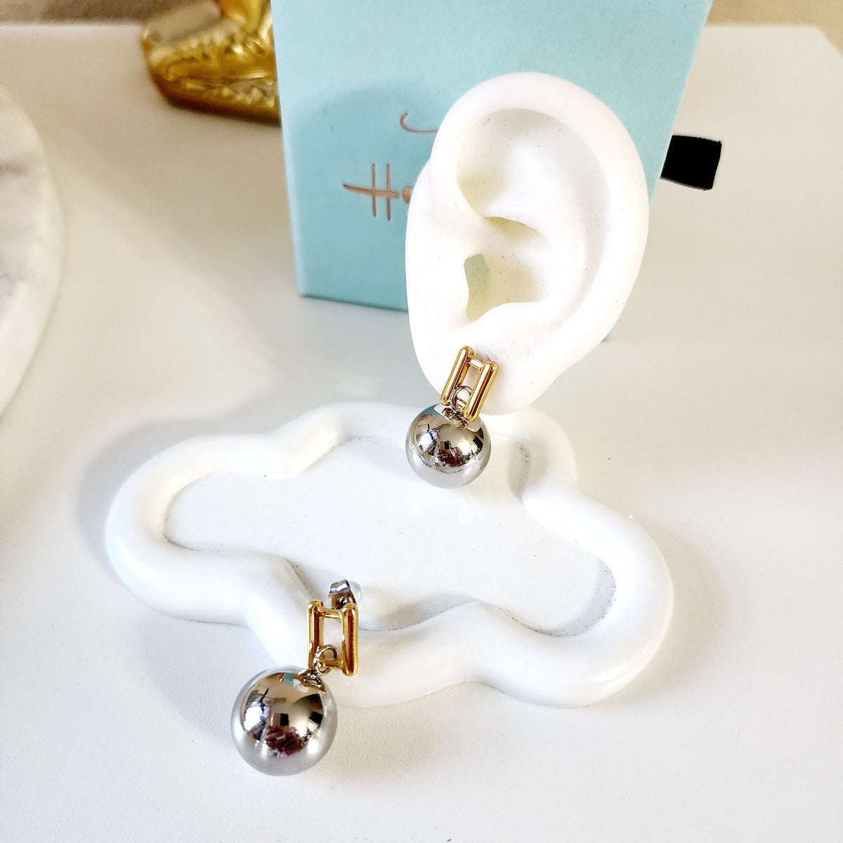 waterproof earrings, drop earrings, ball earrings, sphere earrings, modern minimalist earrings, two-tone earrings, stainless steel earrings, gold and silver earrings, hypoallergenic earrings, tarnish-free jewelry, Hello Luxy jewelry.