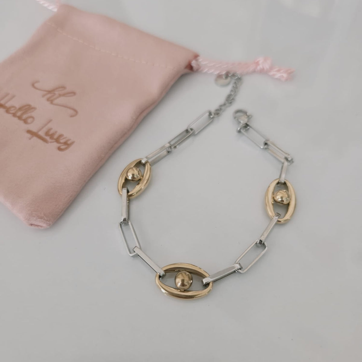 Meet your new everyday statement. This two-tone bracelet blends sleek silver links with rich gold accents, creating the perfect balance of bold and timeless. Its modern chain design makes it versatile enough for daily wear yet striking enough to elevate any outfit.

Crafted in durable stainless steel, this piece is water-resistant, hypoallergenic, and made to keep its shine — no fading, no tarnishing, just effortless glow. Wear it solo for a clean, elegant look or stack it with your favorite bangles for tha