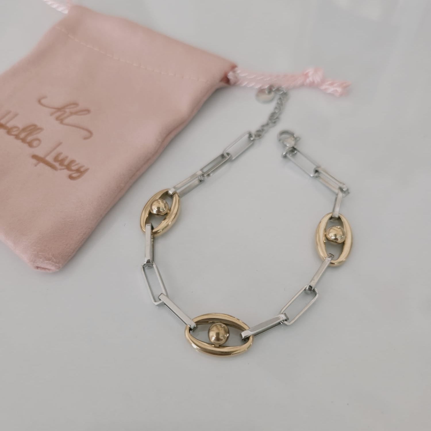 Meet your new everyday statement. This two-tone bracelet blends sleek silver links with rich gold accents, creating the perfect balance of bold and timeless. Its modern chain design makes it versatile enough for daily wear yet striking enough to elevate any outfit.

Crafted in durable stainless steel, this piece is water-resistant, hypoallergenic, and made to keep its shine — no fading, no tarnishing, just effortless glow. Wear it solo for a clean, elegant look or stack it with your favorite bangles for tha