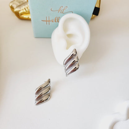 Bold golden studs, bold three tone earrings, bold silver earring, chunky golden studs, geometric jewelry, spiral earrings, spiral silver earrings, hearts silver medium earrings, Silver classy earrings, hearts earrings, self love earrings, silver chunky hearts earrings, two tones chunky earrings, hypoallergenic earrings, two tone everyday hoops, 18k gold plated earrings, Waterproof earrings, Silver and gold earrings, Durable earrings, Elegant earrings, Timeless design, aesthetic earrings, timeless earrings, 