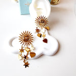 Sun earrings, Gold celestial earrings, Sun and star jewelry, Boho statement earrings,
Unique sun earrings, Sunburst earrings, Celestial jewelry, Star and heart earrings,
Bohemian jewelry style, Gold sun earrings, Dangling celestial earrings, Statement earrings for women, Sun and moon earrings, Vintage-inspired earrings, Spiritual jewelry,
Sun charm earrings, Astrology-inspired jewelry, Durable earrings, Elegant earrings, Timeless design, aesthetic earrings, timeless earrings, Fashion accessories, Stylish je
