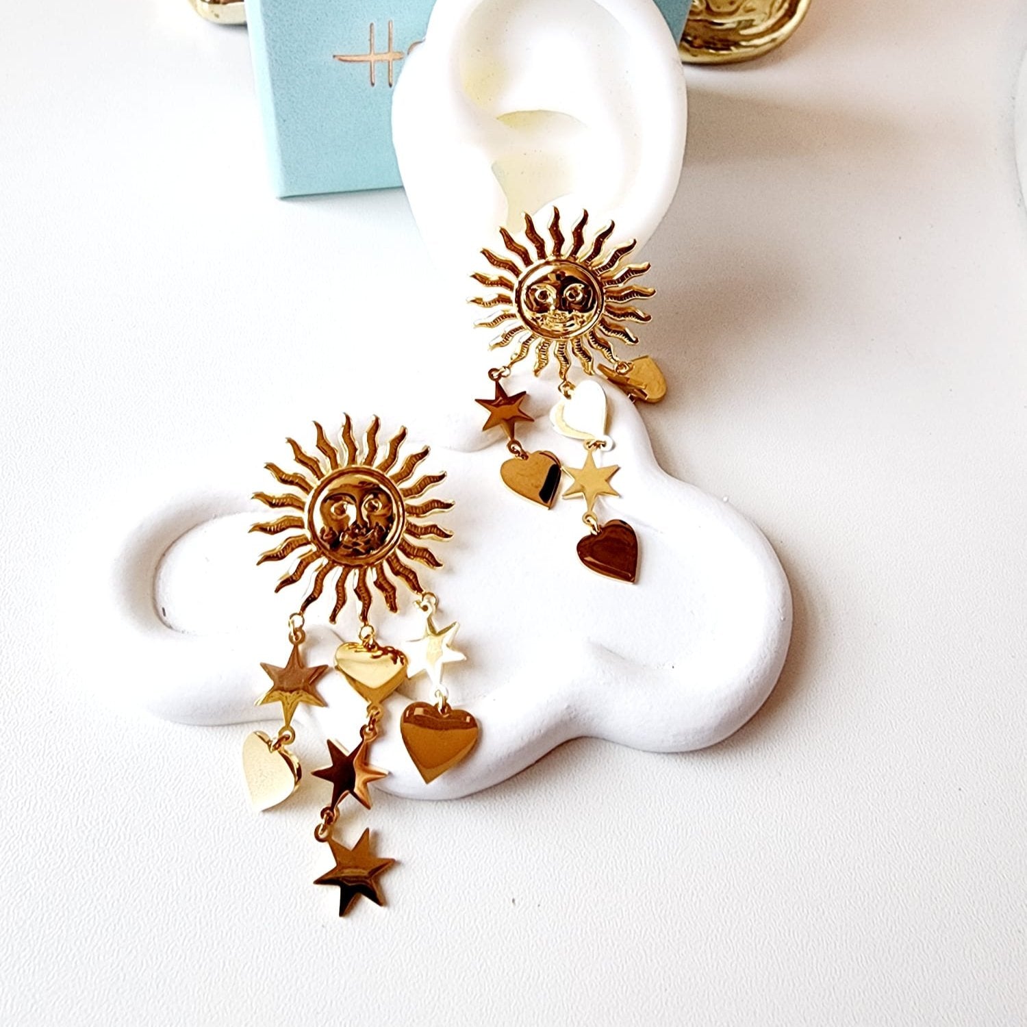 Sun earrings, Gold celestial earrings, Sun and star jewelry, Boho statement earrings,
Unique sun earrings, Sunburst earrings, Celestial jewelry, Star and heart earrings,
Bohemian jewelry style, Gold sun earrings, Dangling celestial earrings, Statement earrings for women, Sun and moon earrings, Vintage-inspired earrings, Spiritual jewelry,
Sun charm earrings, Astrology-inspired jewelry, Durable earrings, Elegant earrings, Timeless design, aesthetic earrings, timeless earrings, Fashion accessories, Stylish je