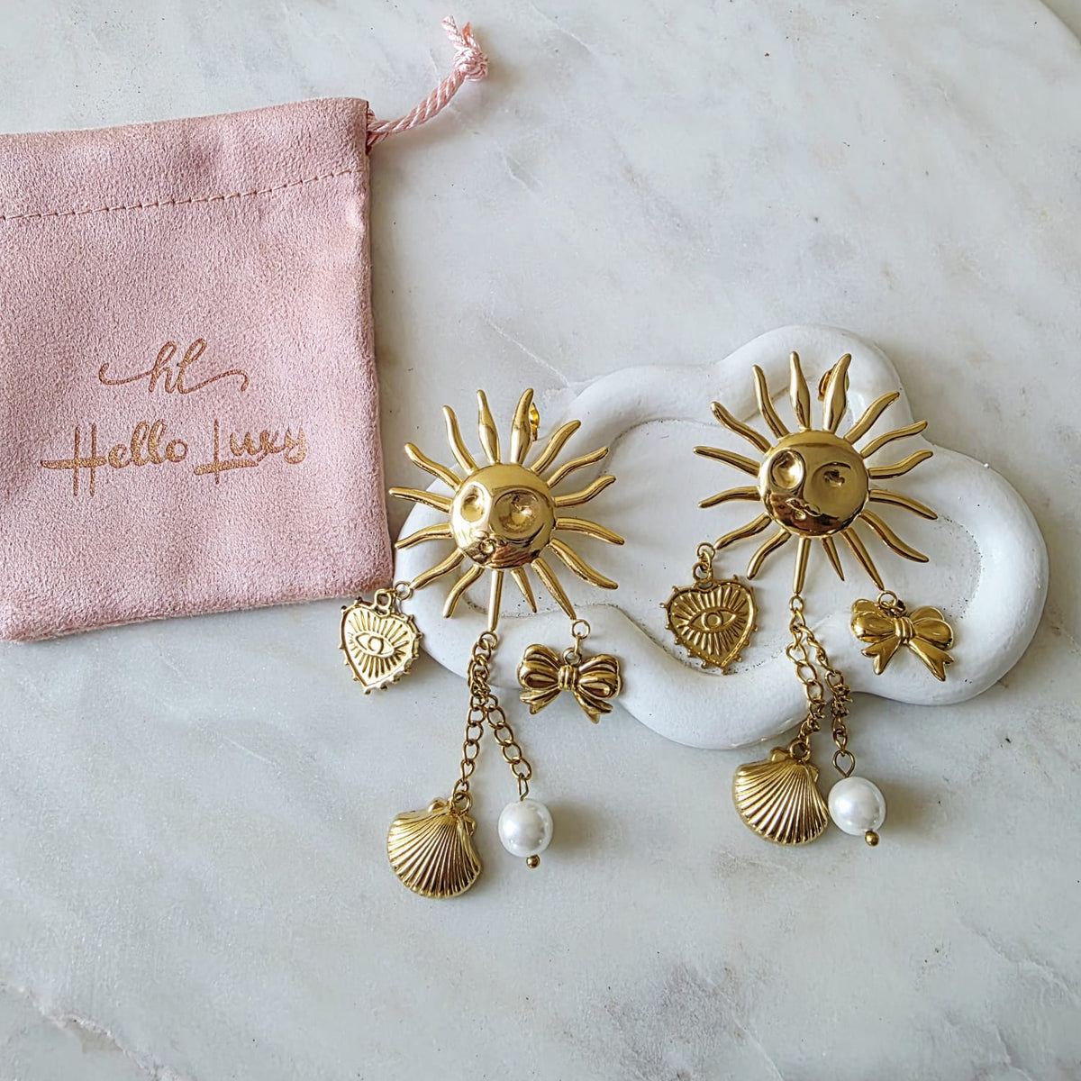 Sun earrings, Gold celestial earrings, Sun and star jewelry, Boho statement earrings,
Unique sun earrings, Sunburst earrings, Celestial jewelry, Star and heart earrings,
Bohemian jewelry style, Gold sun earrings, Dangling celestial earrings, Statement earrings for women, Sun and moon earrings, Vintage-inspired earrings, Spiritual jewelry,
Sun charm earrings, Astrology-inspired jewelry, Durable earrings, Elegant earrings, Timeless design, aesthetic earrings, timeless earrings, Fashion accessories,