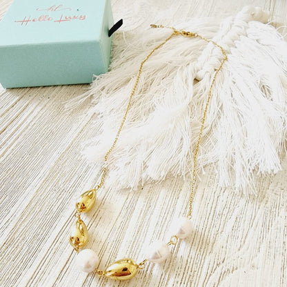 Pearls Gold Necklace, minimalist charm, delicate, simplicity, elegance, understated beauty, dainty pendant, baroque pearls necklace, water-resistant, high-quality, tarnish-resistant, gold-plated stainless steel, longevity, durability, sleek design, versatile, day to night, casual, formal, must-have accessory, water-resistant, radiant, untarnished, exquisite, thoughtful gift, minimalist beauty.