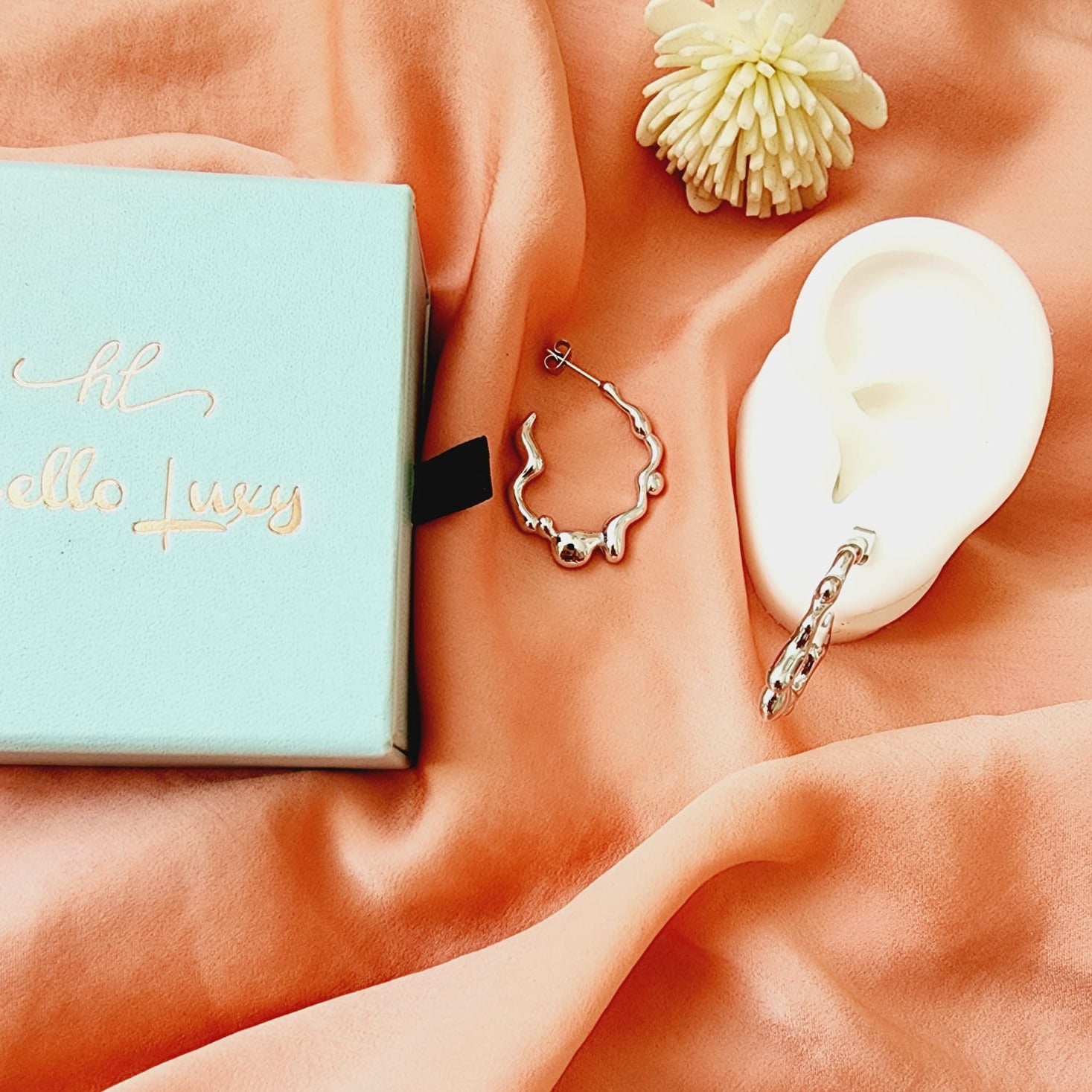 melting lava earrings, silver melting earrings, silver earrings, hypoallergenic earrings, teardrop maxi studs, 18k gold plated earrings, Waterproof earrings, Silver and gold earrings, Durable earrings, Elegant earrings, Timeless design, aesthetic earrings, timeless earrings, Stylish jewelry, stylish earrings, Versatile jewelry, Bold Earrings