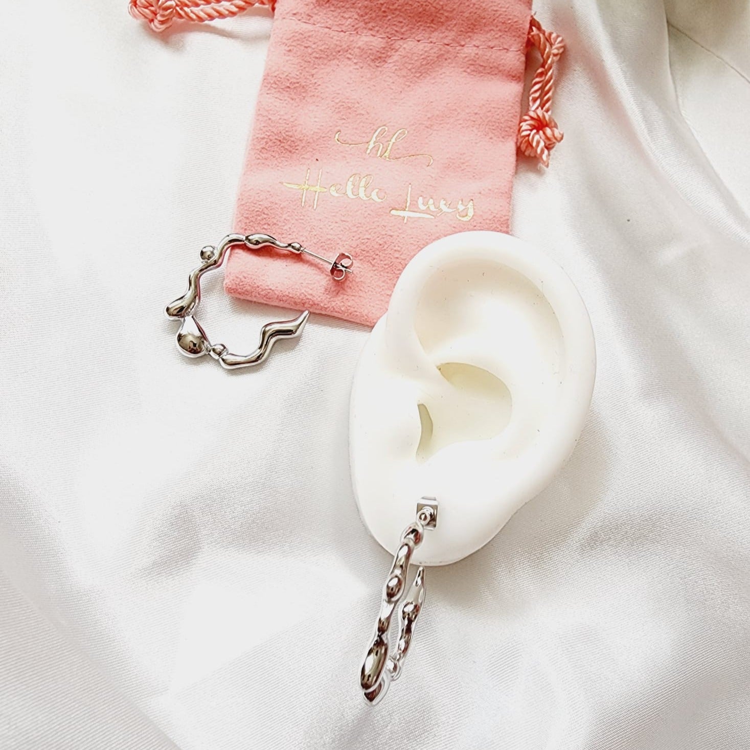 melting lava earrings, silver melting earrings, silver earrings, hypoallergenic earrings, teardrop maxi studs, 18k gold plated earrings, Waterproof earrings, Silver and gold earrings, Durable earrings, Elegant earrings, Timeless design, aesthetic earrings, timeless earrings, Stylish jewelry, stylish earrings, Versatile jewelry, Bold Earrings