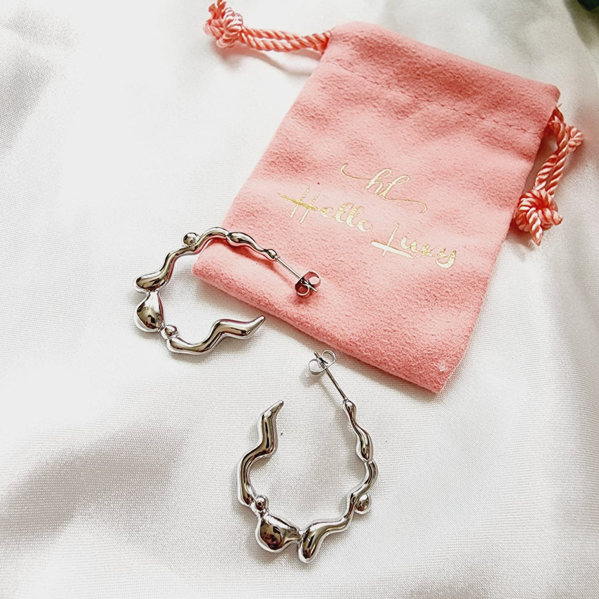 melting lava earrings, silver melting earrings, silver earrings, hypoallergenic earrings, teardrop maxi studs, 18k gold plated earrings, Waterproof earrings, Silver and gold earrings, Durable earrings, Elegant earrings, Timeless design, aesthetic earrings, timeless earrings, Stylish jewelry, stylish earrings, Versatile jewelry, Bold Earrings