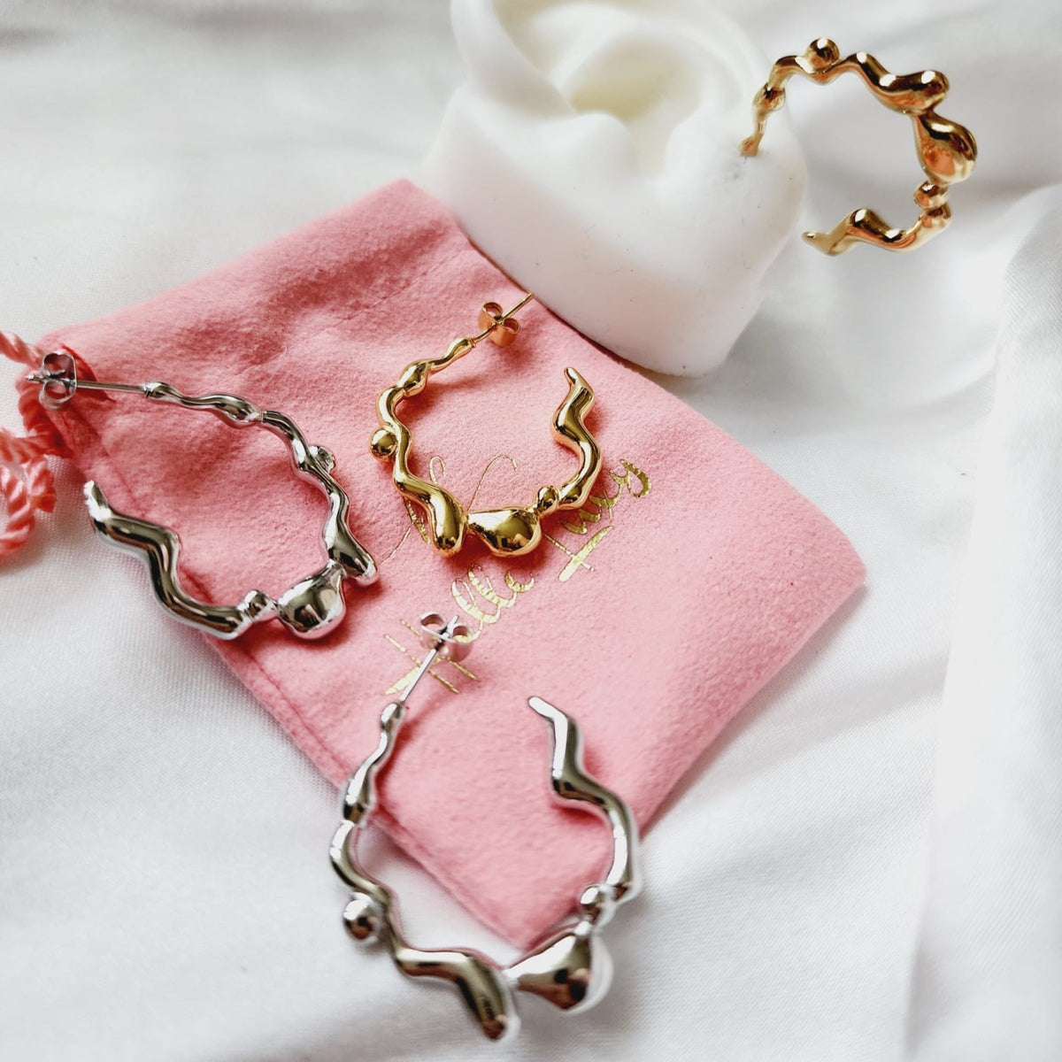 melting lava earrings, silver melting earrings, silver earrings, hypoallergenic earrings, teardrop maxi studs, 18k gold plated earrings, Waterproof earrings, Silver and gold earrings, Durable earrings, Elegant earrings, Timeless design, aesthetic earrings, timeless earrings, Stylish jewelry, stylish earrings, Versatile jewelry, Bold Earrings