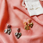 self love jewelry, self love earrings, hearts silver earrings, hearts silver medium earrings, Silver classy earrings, hearts earrings, self love earrings, silver chunky hearts earrings, two tones chunky earrings, hypoallergenic earrings, two tone everyday hoops, 18k gold plated earrings, Waterproof earrings, Silver and gold earrings, Durable earrings, Elegant earrings, Timeless design, aesthetic earrings, timeless earrings, Stylish jewelry, stylish earrings, Versatile jewelry, Bold Earrings, chunky earrings