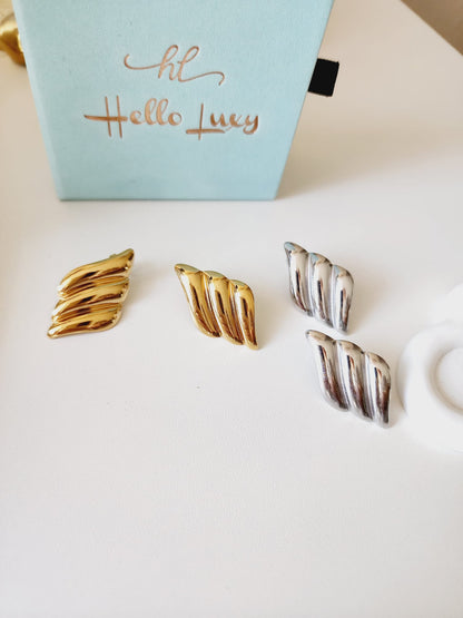 Bold golden studs, bold three tone earrings, bold silver earring, chunky golden studs, geometric jewelry, spiral earrings, spiral silver earrings, hearts silver medium earrings, Silver classy earrings, hearts earrings, self love earrings, silver chunky hearts earrings, two tones chunky earrings, hypoallergenic earrings, two tone everyday hoops, 18k gold plated earrings, Waterproof earrings, Silver and gold earrings, Durable earrings, Elegant earrings, Timeless design, aesthetic earrings, timeless earrings, 