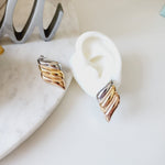 Bold golden studs, bold three tone earrings, bold silver earring, chunky golden studs, geometric jewelry, spiral earrings, spiral silver earrings, hearts silver medium earrings, Silver classy earrings, hearts earrings, self love earrings, silver chunky hearts earrings, two tones chunky earrings, hypoallergenic earrings, two tone everyday hoops, 18k gold plated earrings, Waterproof earrings, Silver and gold earrings, Durable earrings, Elegant earrings, Timeless design, aesthetic earrings, timeless earrings, 