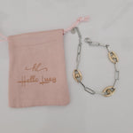 Meet your new everyday statement. This two-tone bracelet blends sleek silver links with rich gold accents, creating the perfect balance of bold and timeless. Its modern chain design makes it versatile enough for daily wear yet striking enough to elevate any outfit.

Crafted in durable stainless steel, this piece is water-resistant, hypoallergenic, and made to keep its shine — no fading, no tarnishing, just effortless glow. Wear it solo for a clean, elegant look or stack it with your favorite bangles for tha