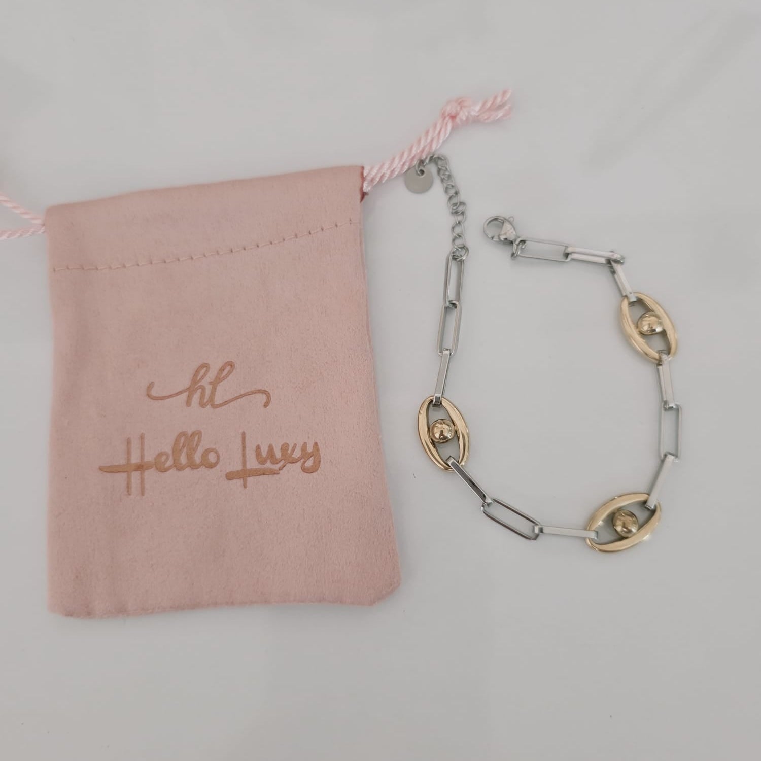 Meet your new everyday statement. This two-tone bracelet blends sleek silver links with rich gold accents, creating the perfect balance of bold and timeless. Its modern chain design makes it versatile enough for daily wear yet striking enough to elevate any outfit.

Crafted in durable stainless steel, this piece is water-resistant, hypoallergenic, and made to keep its shine — no fading, no tarnishing, just effortless glow. Wear it solo for a clean, elegant look or stack it with your favorite bangles for tha